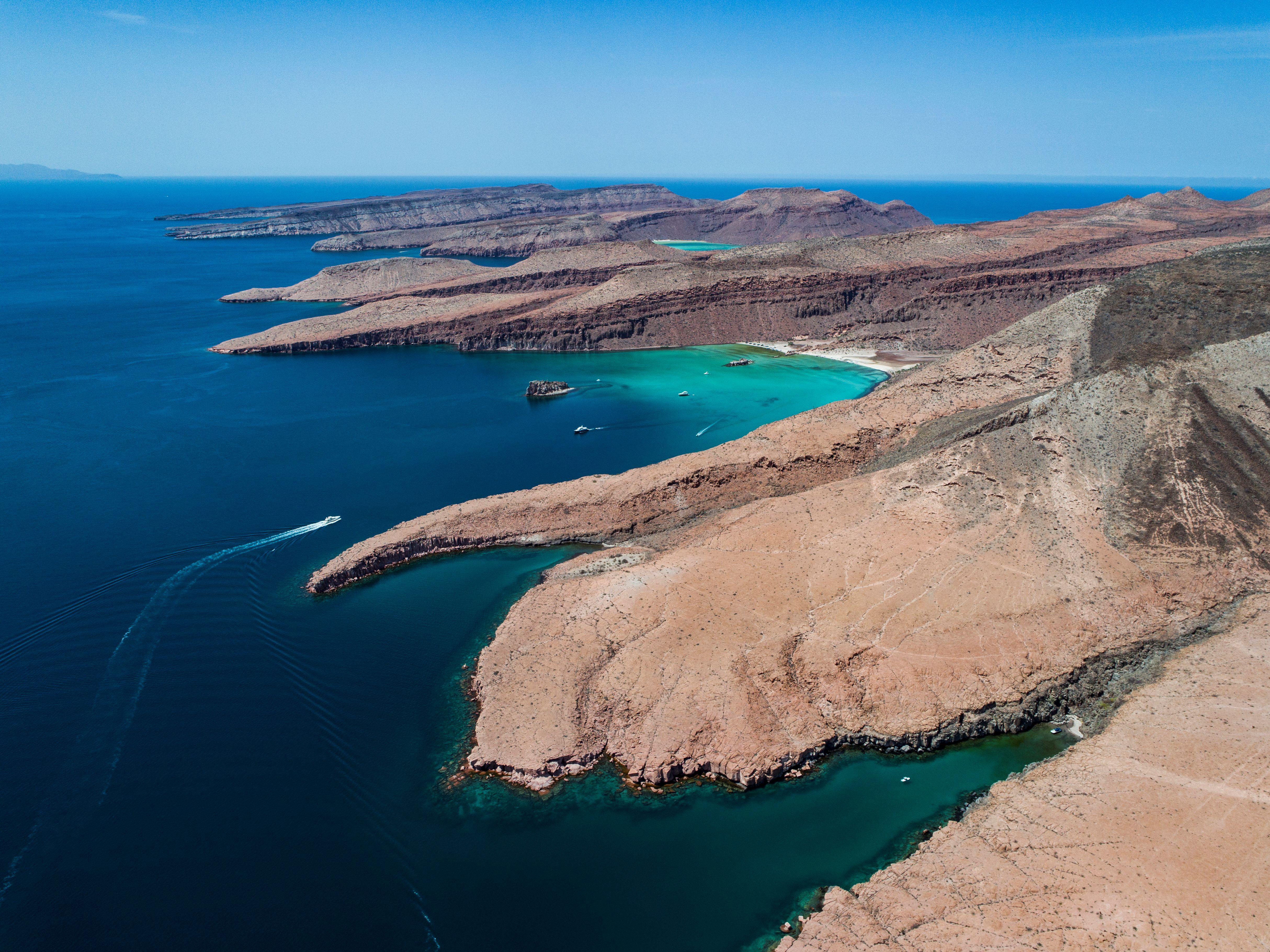 Just beyond La Paz, Espiritu Santo Island showcases the dramatic contrast of desert mountains and remarkably clear waters. Part of the UNESCO World Heritage-listed Islands and Protected Areas of the Gulf of California, the island is defined by volcanic cliffs and secluded beaches