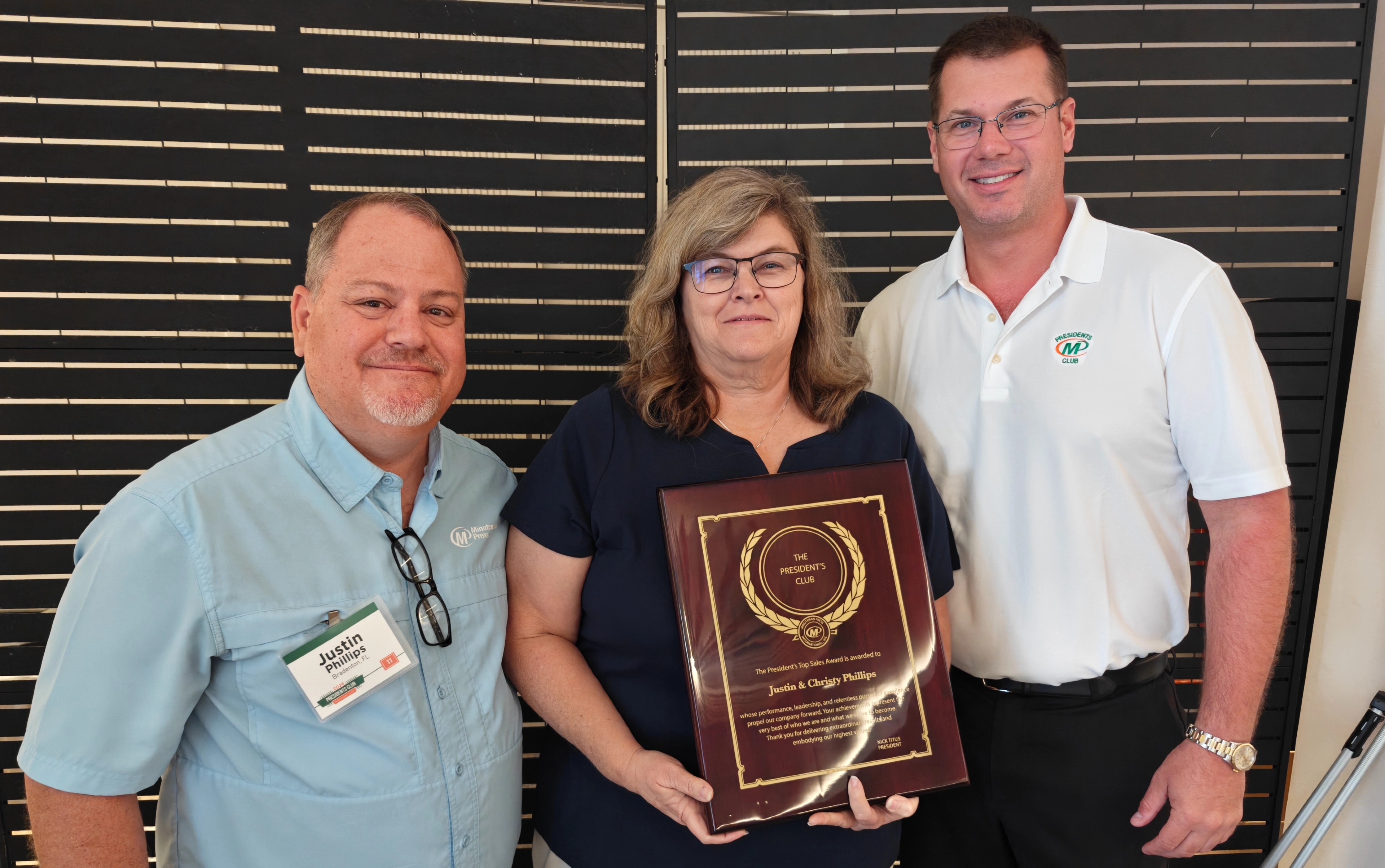 Minuteman Press Bradenton FL Presidents Club Award - Justin and Christy Phillips with Nick Titus - Landscape