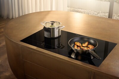 Smart, stylish, flexible: The new KM 8000 hobs offer maximum freedom and generous space for cooking. The intelligent system, consisting of KM 8000 induction hob and M Sense cookware with up to three temperature sensors, automatically regulates temperature and power so nothing burns or boils over. (Photo Miele). Smart, stylish, flexible: The new KM 8000 hobs offer maximum freedom and generous space for cooking. The intelligent system, consisting of KM 8000 induction hob and M Sense cookware with up to three temperature sensors, automatically regulates temperature and power so nothing burns or boils over. (Photo Miele).