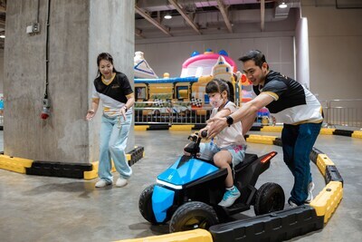 Sands Cares Ambassadors accompany members of local NGOs to play at some of the game booths Thursday at the 2026 Sands Shopping Carnival. (PRNewsfoto/Sands China Ltd.)
